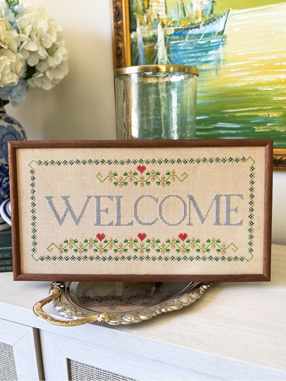 Vintage “Welcome” Cross Stitch Sign in Light Blue and Red
